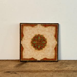 Vintage tile and wood trivet, beige ceramic tile with terra cotta and green embossed floral design, retro kitchen accessory, circa 1970s