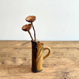 Small hand-made ceramic pitcher or vase, signed studio pottery, brown with drip glazing and etched abstract designs, circa 1960s