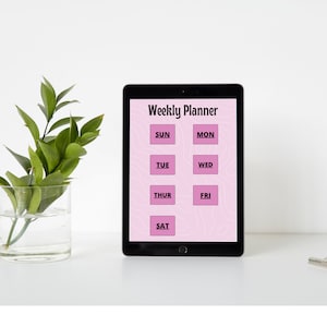 Könnte beinhalten: Eine digitale Wochenplaner-App auf einem Tablet mit rosa Hintergrund und weißem Text. Die Wochentage werden in einem Raster angezeigt: So, Mo, Di, Mi, Do, Fr, Sa.