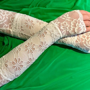 White long stretch daisy design fabric with  white lace fingerless gloves.