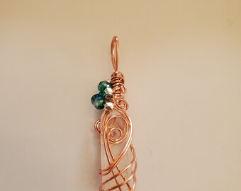 A copper wrapped natural quartz crystal pendant with AB glass beads on an adjustable satin cord