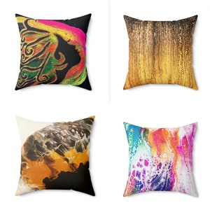 May include: Set of four square throw pillows with abstract designs. The pillows feature a variety of colors and patterns, including black, white, gold, orange, pink, blue, green, and yellow.