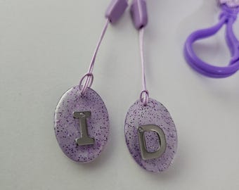 Radiology X-Ray Markers; Metal D & I (Spanish) lilac simple oval design
