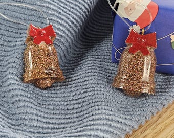 Christmas Tree Decorations; pair of glitter resin bells with red bow detail, hand painted