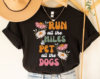 May include: Black t-shirt with a floral design and the text "Run all the miles & Pet all the dogs".