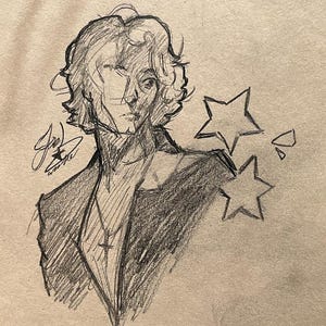 May include: A graphite pencil sketch on tan paper depicting a person with wavy hair, wearing a collared jacket and a cross necklace. The drawing includes two five-pointed stars and a signature on the left side, rendered in loose, expressive lines.