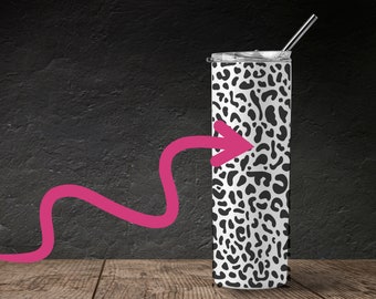 May include: A stainless steel tumbler with a black and white leopard print design. The tumbler has a lid and a straw.