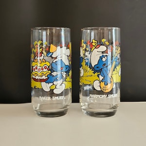 NOS Peyo SET OF 2 Smurf Glasses, Hardee&#39;s Collection 1983, Smurfs Baker Smurf, Harmony Smurf, Wallace Berrie & Co