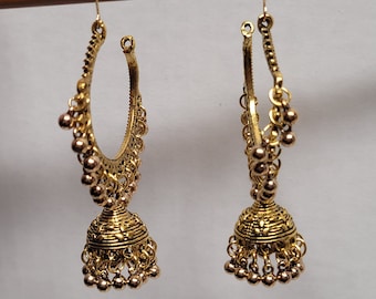 May include: A pair of gold hoop earrings with a bell-shaped dangle. The earrings are made of metal and have a delicate design.