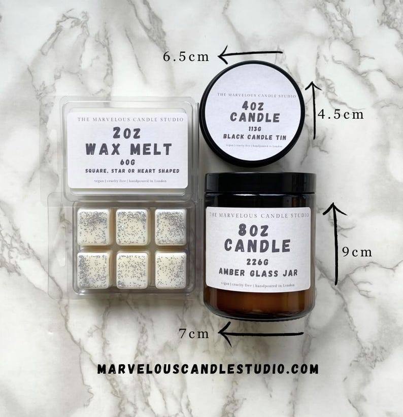 May include: A set of three candles in different sizes and styles. The largest candle is an 8 ounce amber glass jar candle. The middle candle is a 4 ounce black tin candle. The smallest candle is a 2 ounce wax melt in a clear plastic container with six individual wax melts. The wax melts are white with silver glitter.