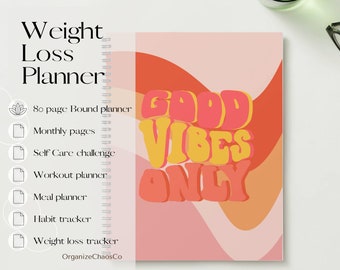 May include: A pink and orange planner with the text "Good Vibes Only" in a retro font. The planner includes sections for monthly pages, self-care challenges, workout plans, meal planning, habit tracking, and weight loss tracking.
