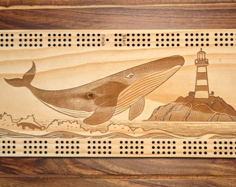 Whale jumping out of the ocean with a lighthouse, 3 Track Cribbage Board - Laser engraved