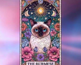 May include: A rectangular tarot card featuring a Burmese cat with blue eyes centred among colourful flowers. Above the cat is a glowing sun and crescent moons against a dark starry sky. The text THE BURMESE is printed in a white box at the bottom.