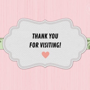 May include: A white, decorative, scalloped frame with the text "Thank You For Visiting!" in black lettering. A small pink heart is centered below the text.