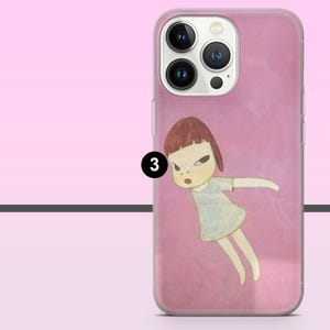 May include: Pink phone case featuring a cartoon illustration of a girl with a stern expression. The girl has short brown hair and is wearing a light blue dress. The phone case has a clear border and a pink background.