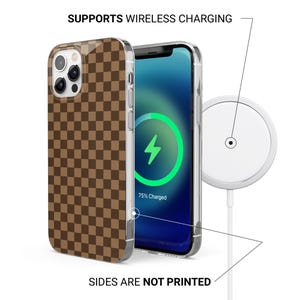 May include: A brown and tan checkered phone case with a clear border. The phone screen displays a charging symbol. A white wireless charger is also shown. Text reads: "SUPPORTS WIRELESS CHARGING" and "SIDES ARE NOT PRINTED."