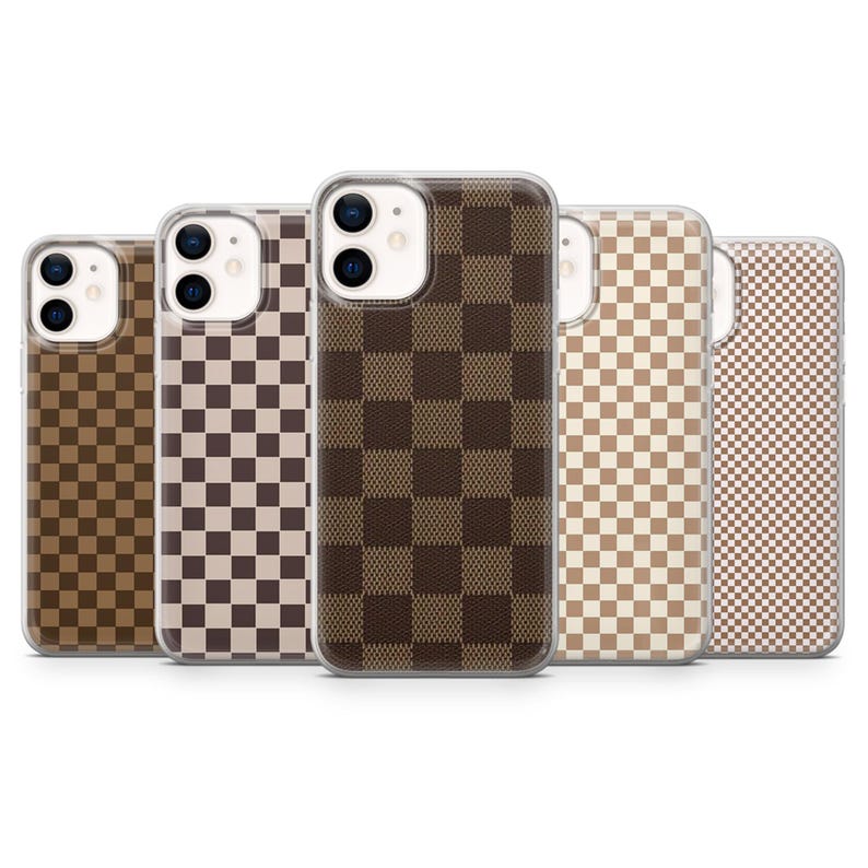 May include: A collection of five phone cases with a checkered pattern in various shades of brown and beige. The cases are designed to fit a smartphone, with camera and button cutouts visible.