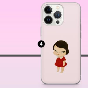 May include: A light pink phone case featuring a cartoon illustration of a girl in a red dress with a white collar and an angry expression. The phone case has a camera cutout and a smooth finish.