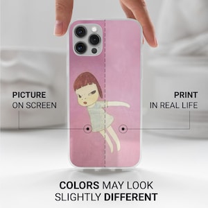 May include: A pink phone case featuring a cartoon illustration of a girl with a stern expression. The case has a clear border and the text "PICTURE ON SCREEN" and "PRINT IN REAL LIFE". The text "COLORS MAY LOOK SLIGHTLY DIFFERENT" is also visible.