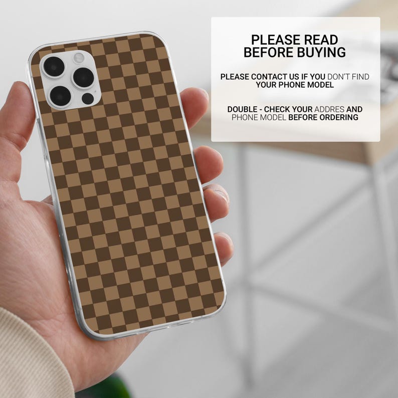 May include: A phone case with a brown and dark brown checkered pattern. The case has a clear border and a camera cutout. Text on a white background reads "PLEASE READ BEFORE BUYING".