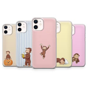 May include: A set of five phone cases with Curious George illustrations. The cases are in different colours: beige, blue stripes, pink, yellow, and pink. Each case features a different image of Curious George, including one holding a banana and another sleeping.