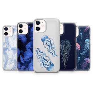 May include: Five clear smartphone cases arranged in a row, each featuring a unique jellyfish illustration. Designs include light blue, deep navy, and multi-colored jellyfish patterns with varying levels of detail, from watercolor styles to fine line art.