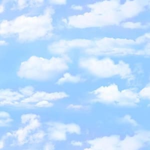 May include: A bright blue sky with fluffy white clouds. The clouds are scattered across the sky, creating a sense of peace and tranquility.