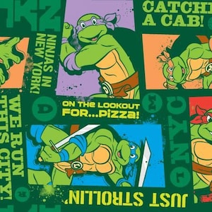 May include: A green and black fabric with a repeating pattern of Teenage Mutant Ninja Turtles characters. The characters are in different poses and have speech bubbles with text like "Ninjas in New York!" and "Catch a Cab!"