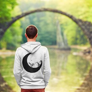 Mountains in the Moon Unisex Hoodie | Celestial Mountain Graphic Pullover | Cozy Outdoor Adventure Sweatshirt