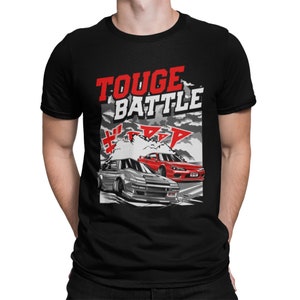 May include: Black t-shirt with a red and white graphic of two cars racing with the text "Touge Battle" above them.