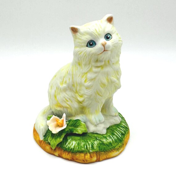 Decorative Porcelain Cat Ornament - Blue-Eyed Kitty on Grass with Pink Floral Detail