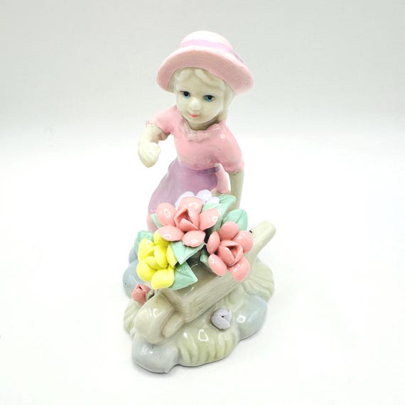 Vintage Girl Figurine with Wheelbarrow and Pastel Flowers