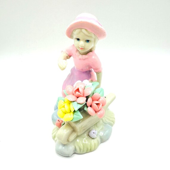 Vintage Girl Figurine with Wheelbarrow and Pastel Flowers