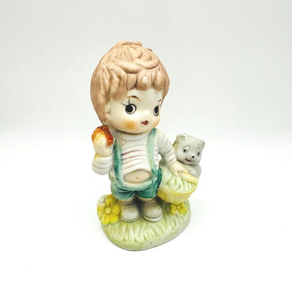Charming Vintage Boy Figurine with Apple and Furry Companion