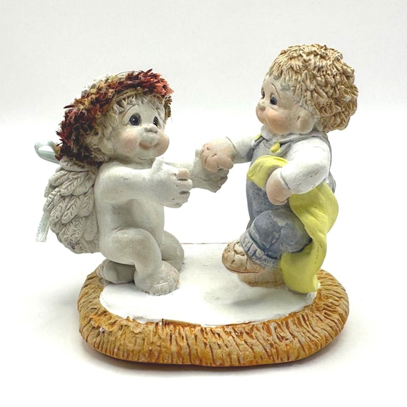 Vintage Dreamsicle Cherub Figurine with Baby in Yellow Blanket