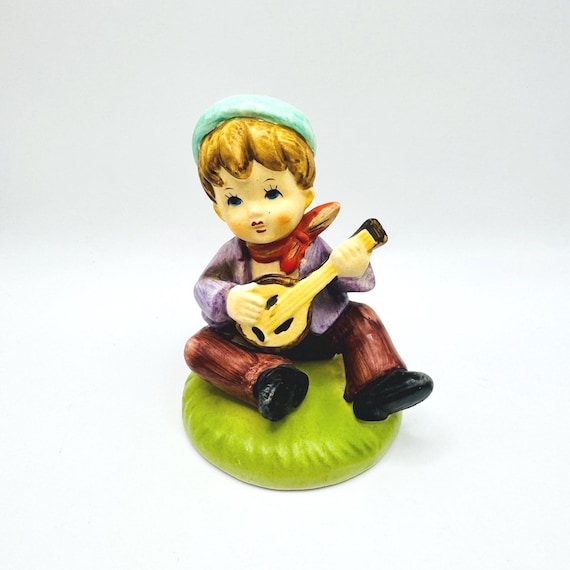 Hand Painted Porcelain Boy Musician Figurine with Beanie and Scarf