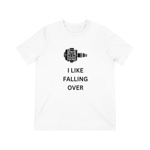 May include: White t-shirt with a black graphic of a bicycle pedal and the text "I LIKE FALLING OVER" in black. The shirt is made of a soft, lightweight material.