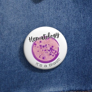 May include: A white button with a purple circle and pink dots in the centre. The text "Hematology It's a Blast!" is written in black on the button.
