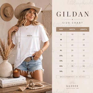 May include: A white Gildan G64000 softstyle t-shirt size chart displaying width and length measurements in inches for sizes S through 5XL. The chart includes a visual guide on a t-shirt showing how to measure width and length for accurate sizing.