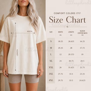 以下が含まれることがあります： サイズチャート付きのクリーム色のTシャツ。Sから4XLまでのサイズが記載されており、幅、長さ、袖丈の中心の背面がインチで測定されています。Tシャツは人が着ています。