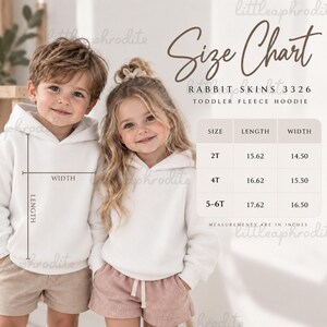 May include: A size chart for a Rabbit Skins 3326 toddler fleece hoodie. The chart displays length and width measurements in inches for sizes 2T, 4T, and 5-6T. A diagram shows how to measure the width and length on a plain white hooded sweatshirt.