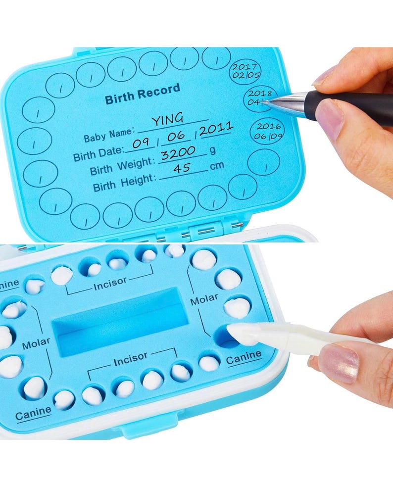 May include: A blue plastic baby tooth storage box with a white lid. The box has a chart for recording the baby's birth information, including name, date, weight, and height. The box also has a chart for tracking the baby's teeth, with spaces for each tooth. The box is open and the lid is flipped over. The box is labeled "Birth Record".