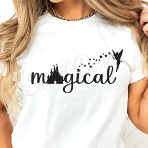 May include: White t-shirt with a black silhouette of Cinderella's castle and Tinkerbell with stars, and the text "magical".