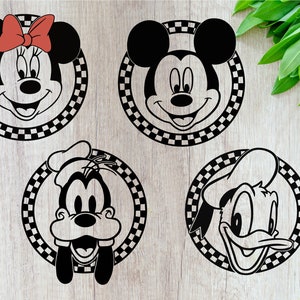 May include: Four black and white cartoon character heads in a checkered circle frame. Mickey Mouse, Minnie Mouse, Goofy, and Donald Duck.
