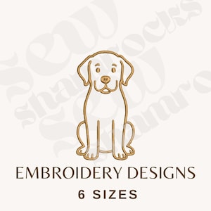 May include: A gold-colored line drawing of a Labrador Retriever dog in a sitting position. The text "EMBROIDERY DESIGNS" and "6 SIZES" are below the dog illustration.