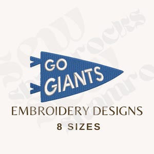 May include: A blue triangular pennant embroidery design featuring the white text GO GIANTS. The design includes two small blue tabs on the left side. Below the pennant, the text reads EMBROIDERY DESIGNS and 8 SIZES in a dark brown font.