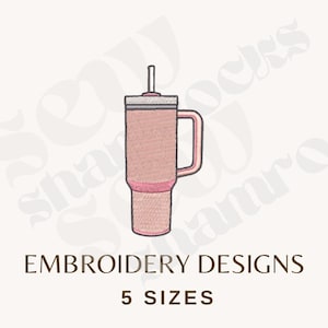 May include: A pink tumbler with a handle and straw, outlined in a darker pink. The text "EMBROIDERY DESIGNS" and "5 SIZES" are below the tumbler image. The design is on a light beige background.