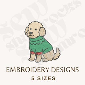 May include: An embroidered design of a tan-colored dog wearing a green sweater with red trim. The image includes the text "EMBROIDERY DESIGNS" and "5 SIZES" in brown font.