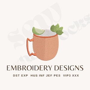 May include: An embroidery design featuring a copper-colored mug with a jagged handle, filled with a white liquid, garnished with a green lime wedge and mint leaves. Text below reads EMBROIDERY DESIGNS followed by DST EXP HUS INF JEF PES VIP3 XXX.