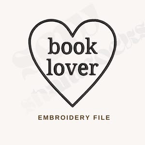 May include: Black and white embroidery design of a heart with the text "book lover" inside.